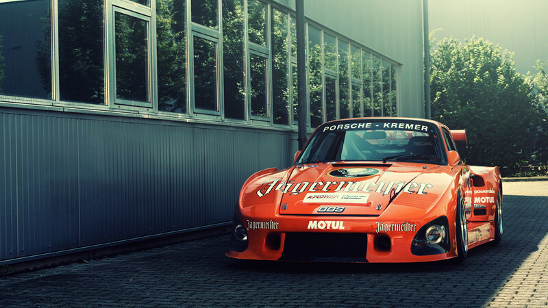 Orange Race Car — Dramatic, Afternoon, Photograph, Building