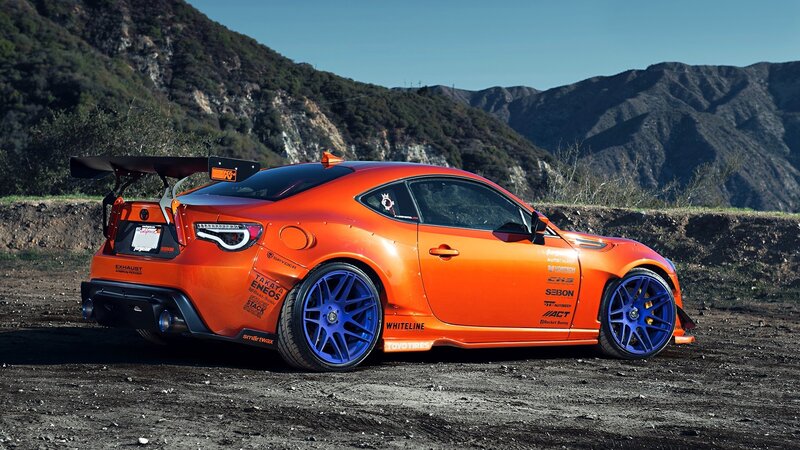 Orange Race Car — Dramatic, Afternoon, Photograph, Mountains