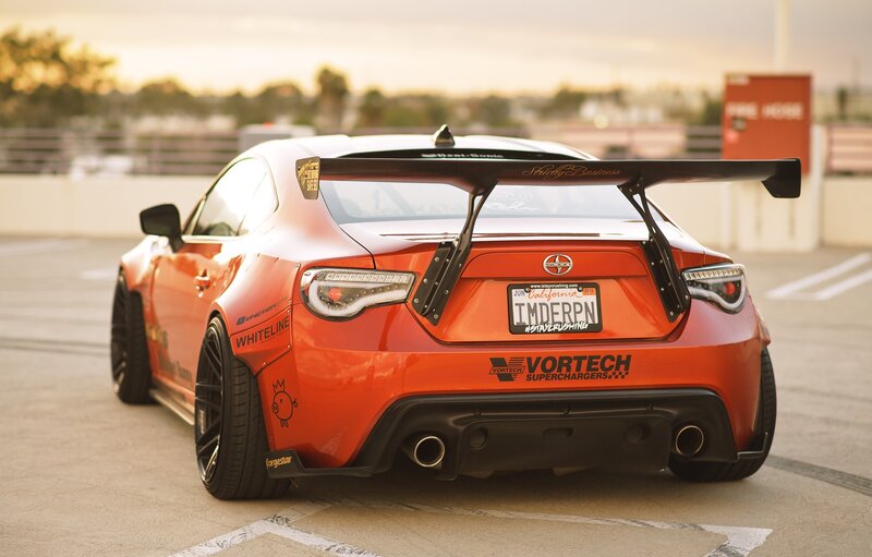 Orange Race Car — Dramatic, Sunset, Photograph, License Plate