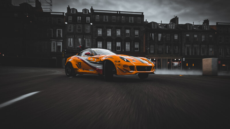 Orange Race Car Drifting — Dramatic