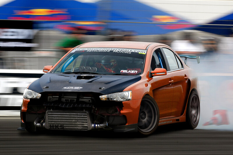 Orange race car drifting