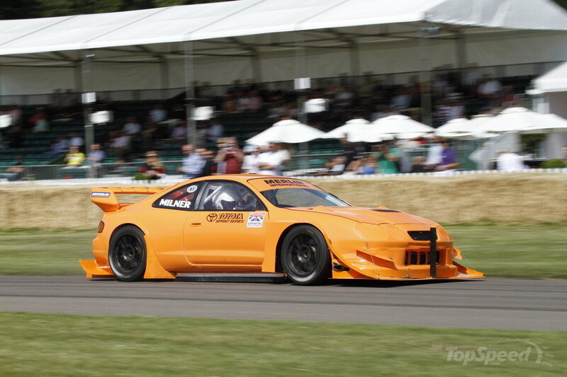 Orange Race Car — Dynamic, Afternoon, Photograph, Crowd