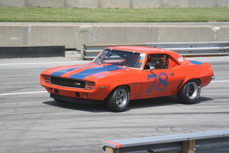 Orange Race Car — Dynamic, Afternoon, Photograph, Race Track, Guardrail