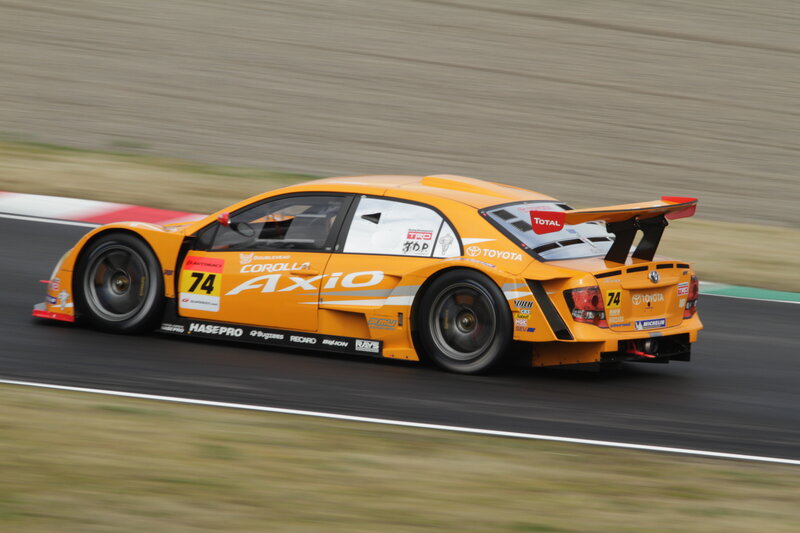 Orange Race Car — Dynamic, Afternoon, Photograph, Race Track, Wings
