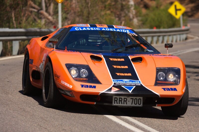 Orange Race Car — Dynamic, Afternoon, Photograph, Road