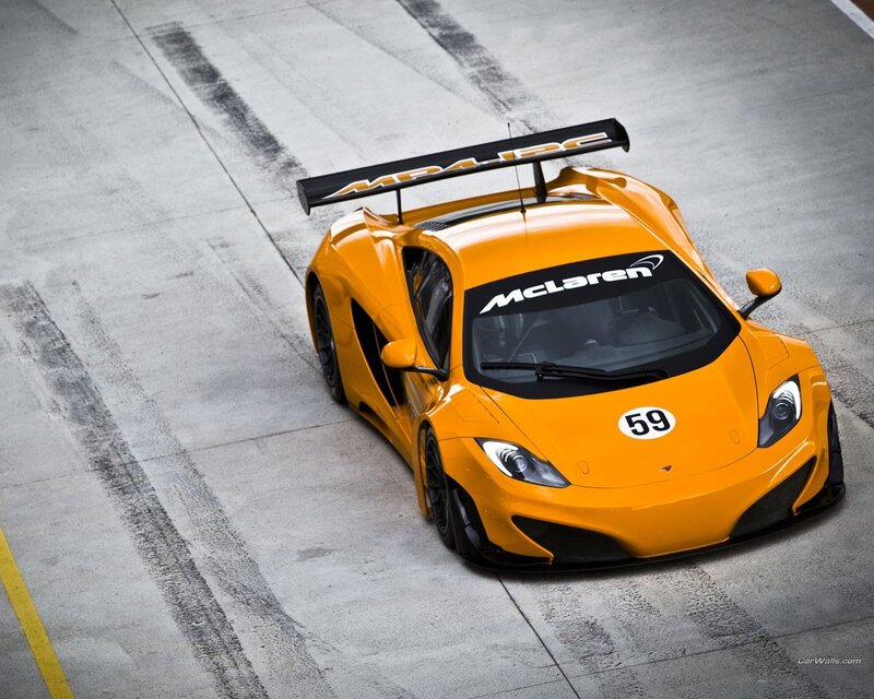 Orange Race Car — Dynamic, Photograph, Race Track, Tire Marks, Rear Wing