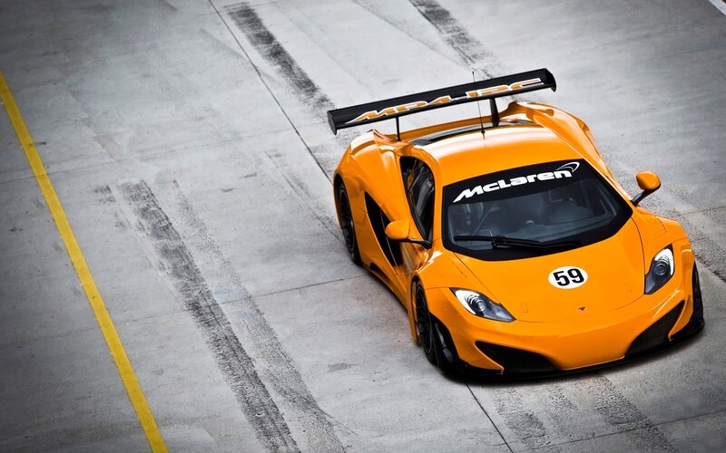 Orange Race Car — Dynamic, Photograph, Race Track, Tire Marks