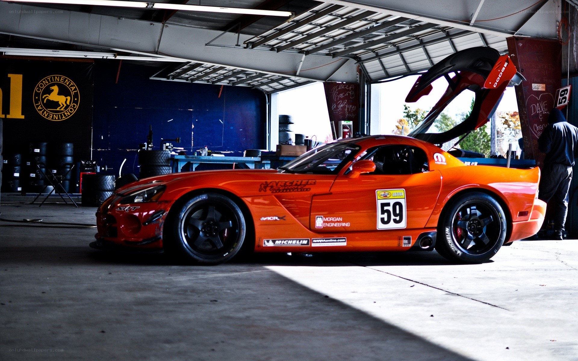 Orange race car in garage