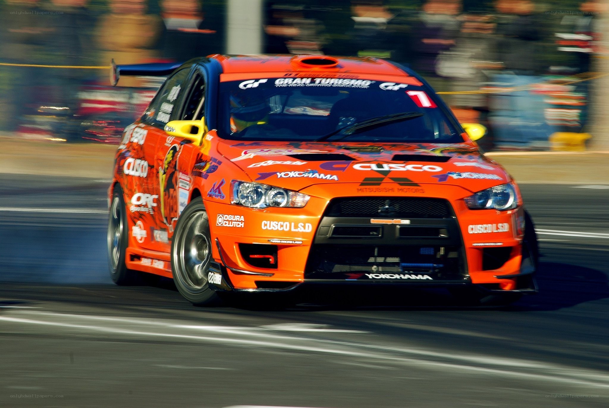 orange race car in motion