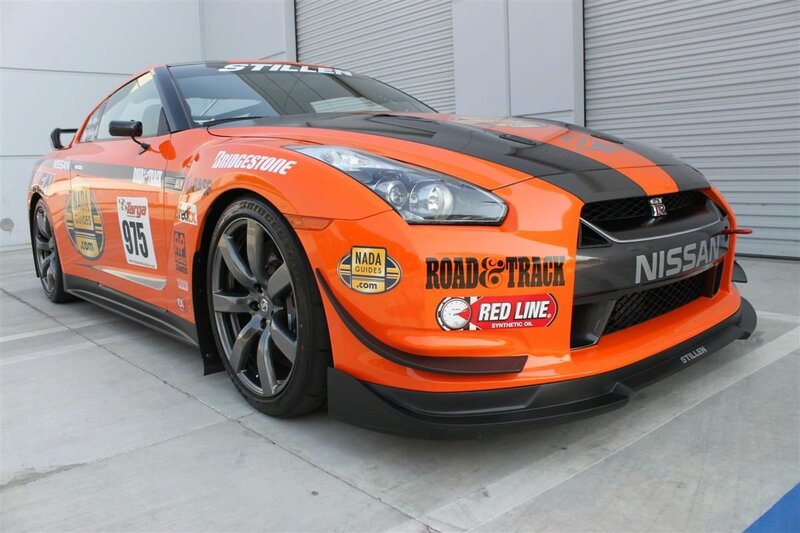 Orange Race Car — Neutral, Photograph, Race Car, Sponsor Logos