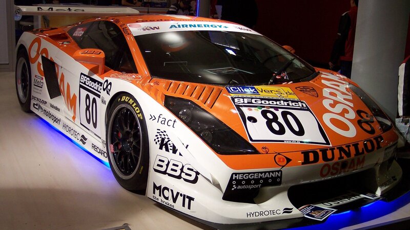 Orange Race Car — Neutral, Photograph, Race Car, Sponsors, Lights