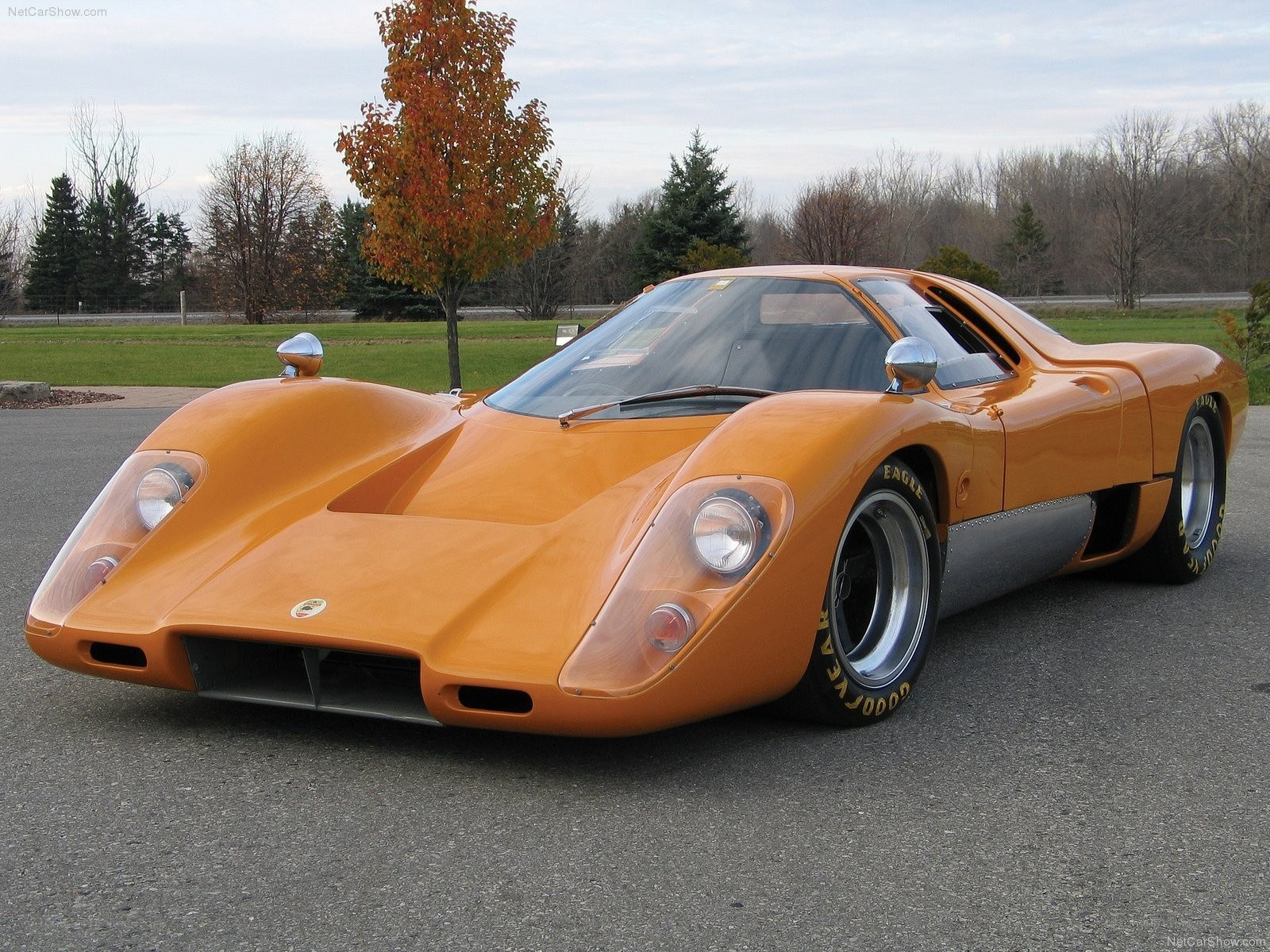 Orange race car on asphalt