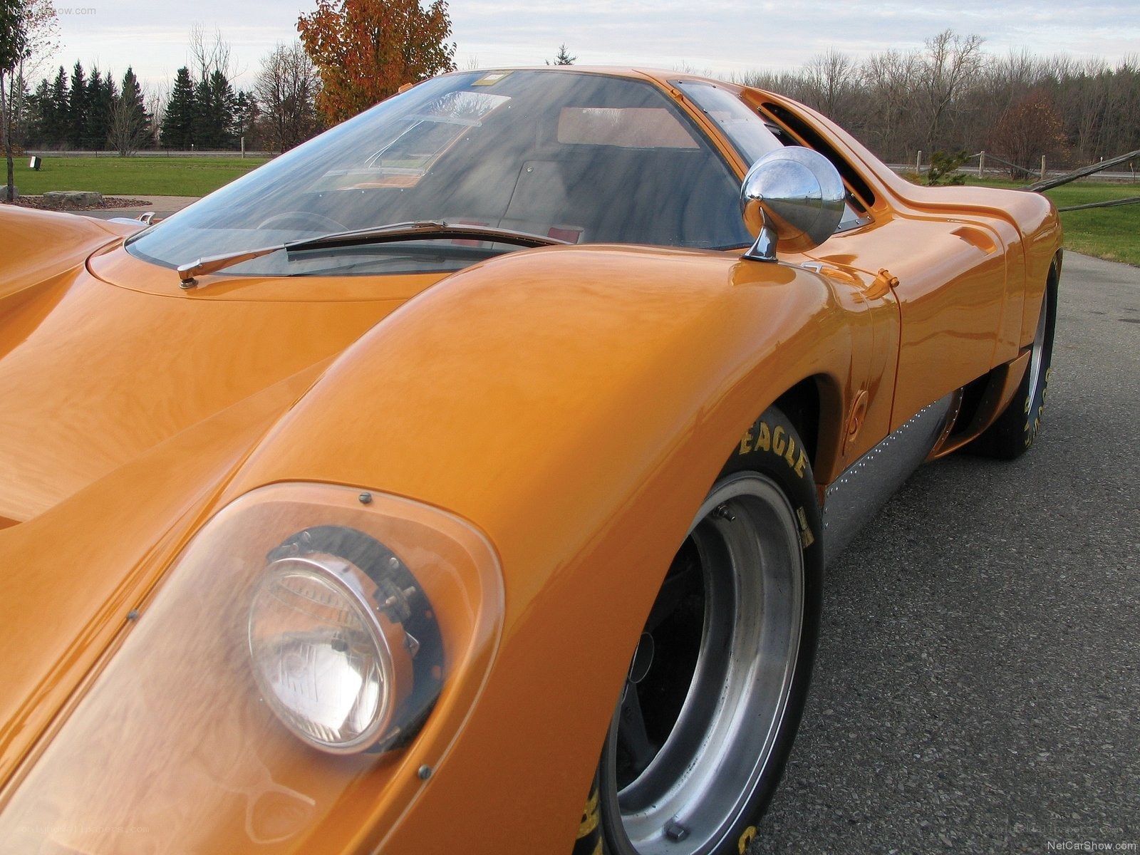 orange race car on asphalt