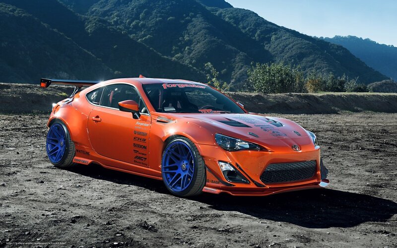 orange race car on dirt
