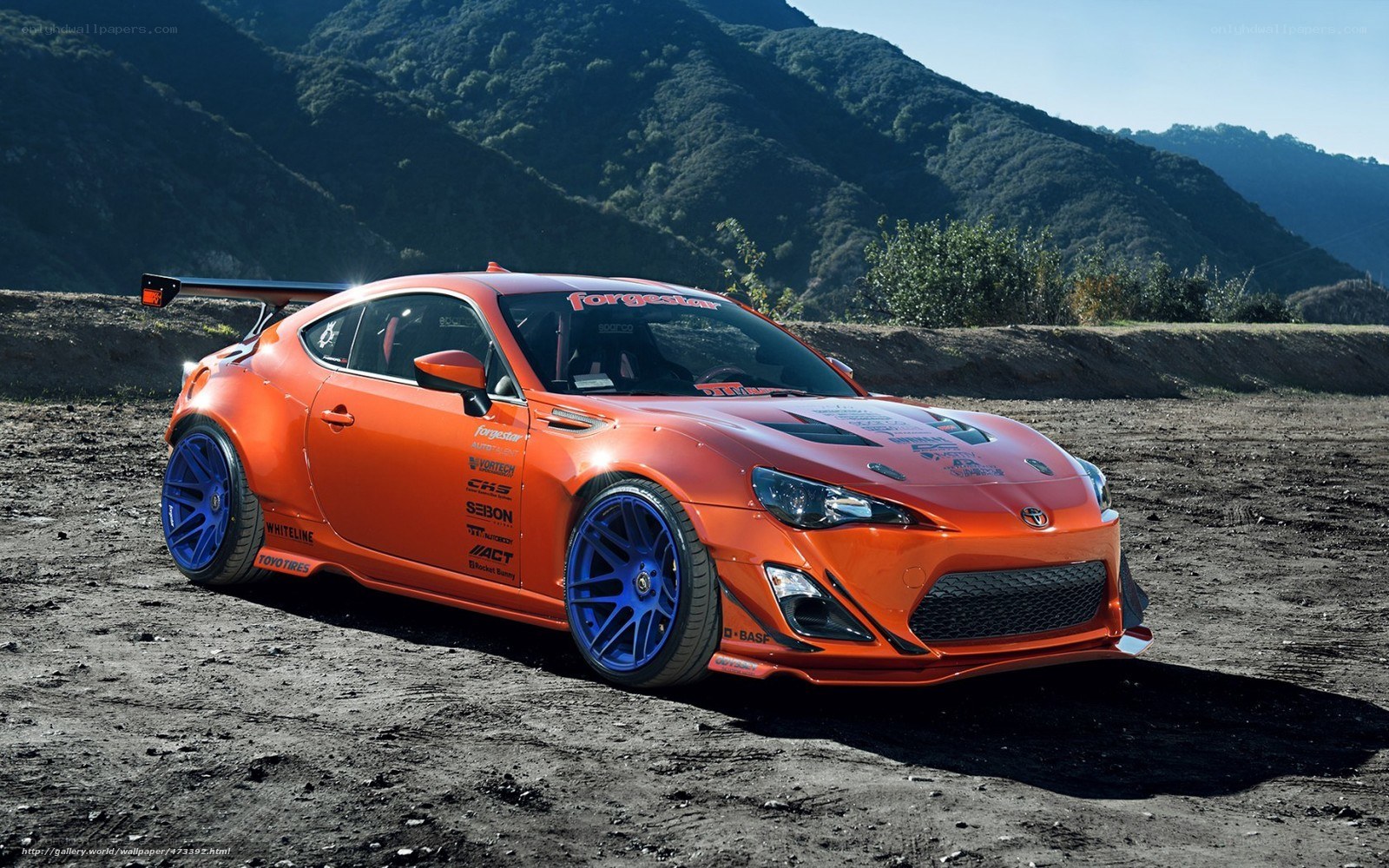 orange race car on dirt