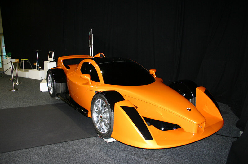 Orange race car on display