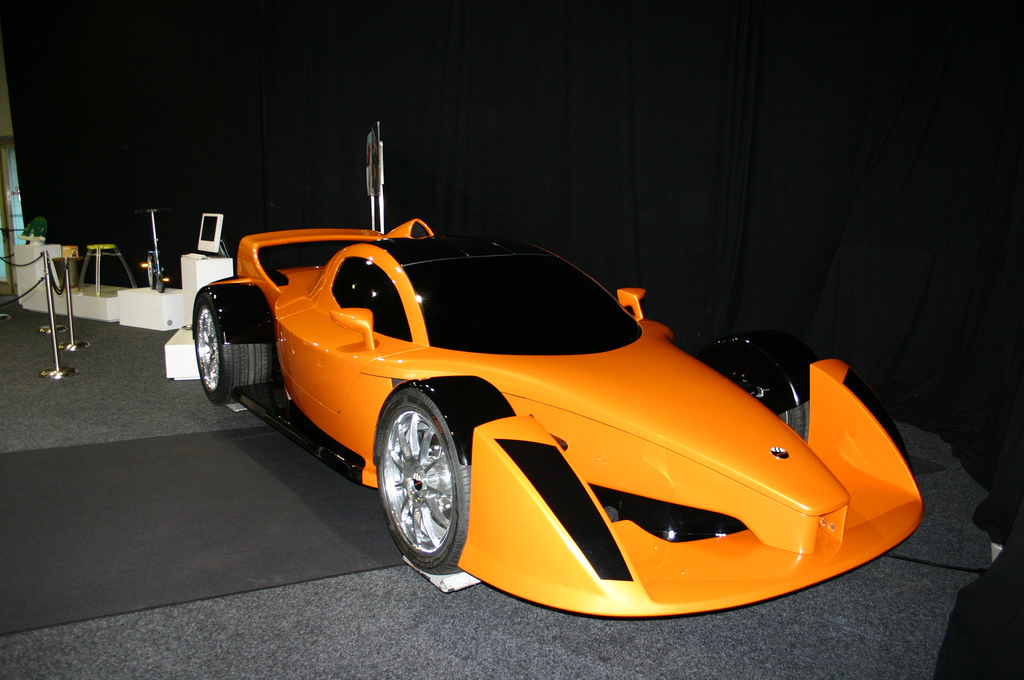 Orange race car on display