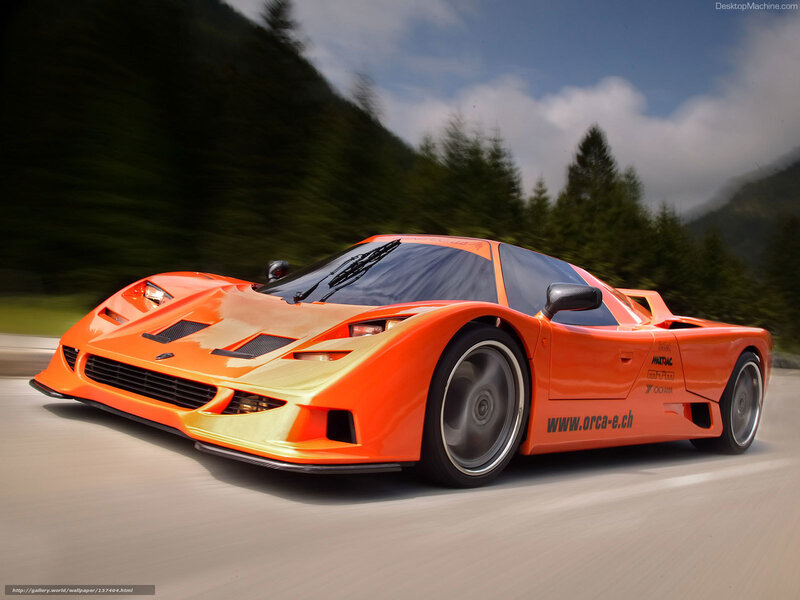 orange race car on mountain road
