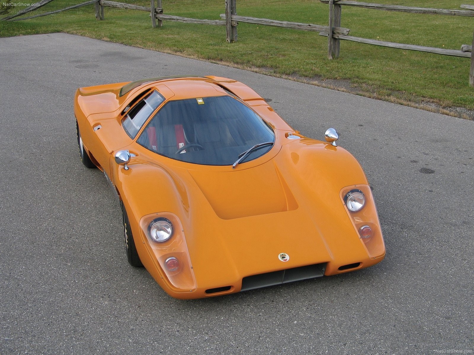 orange race car on pavement