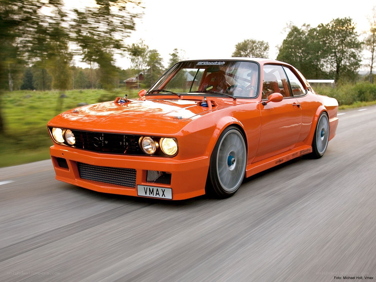 orange race car on road