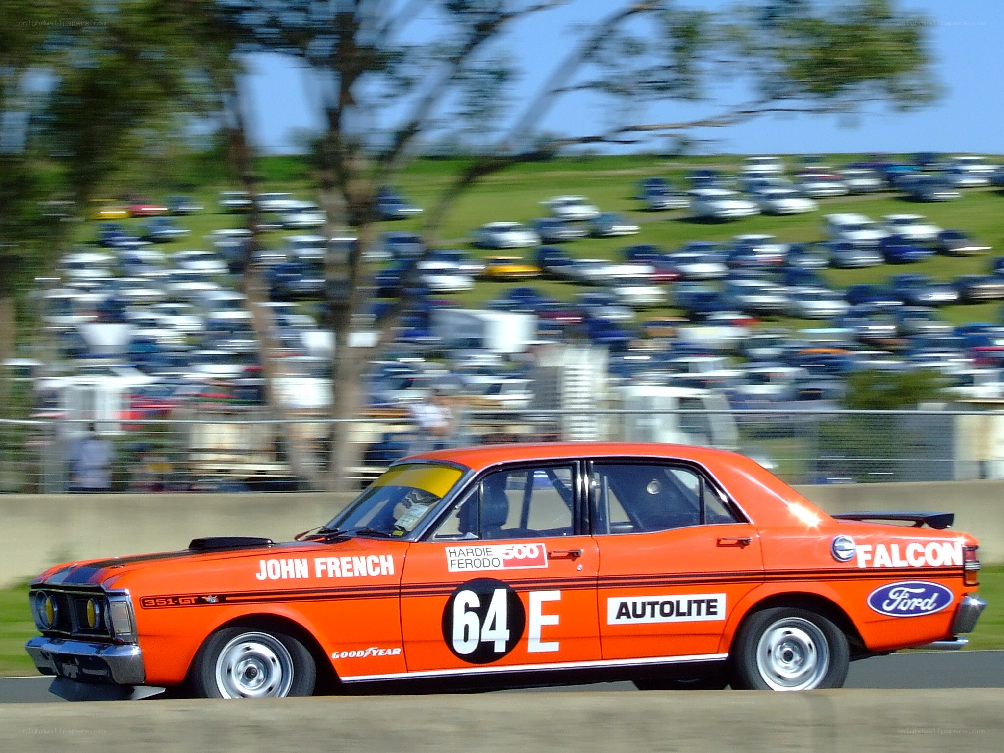 Orange race car on track
