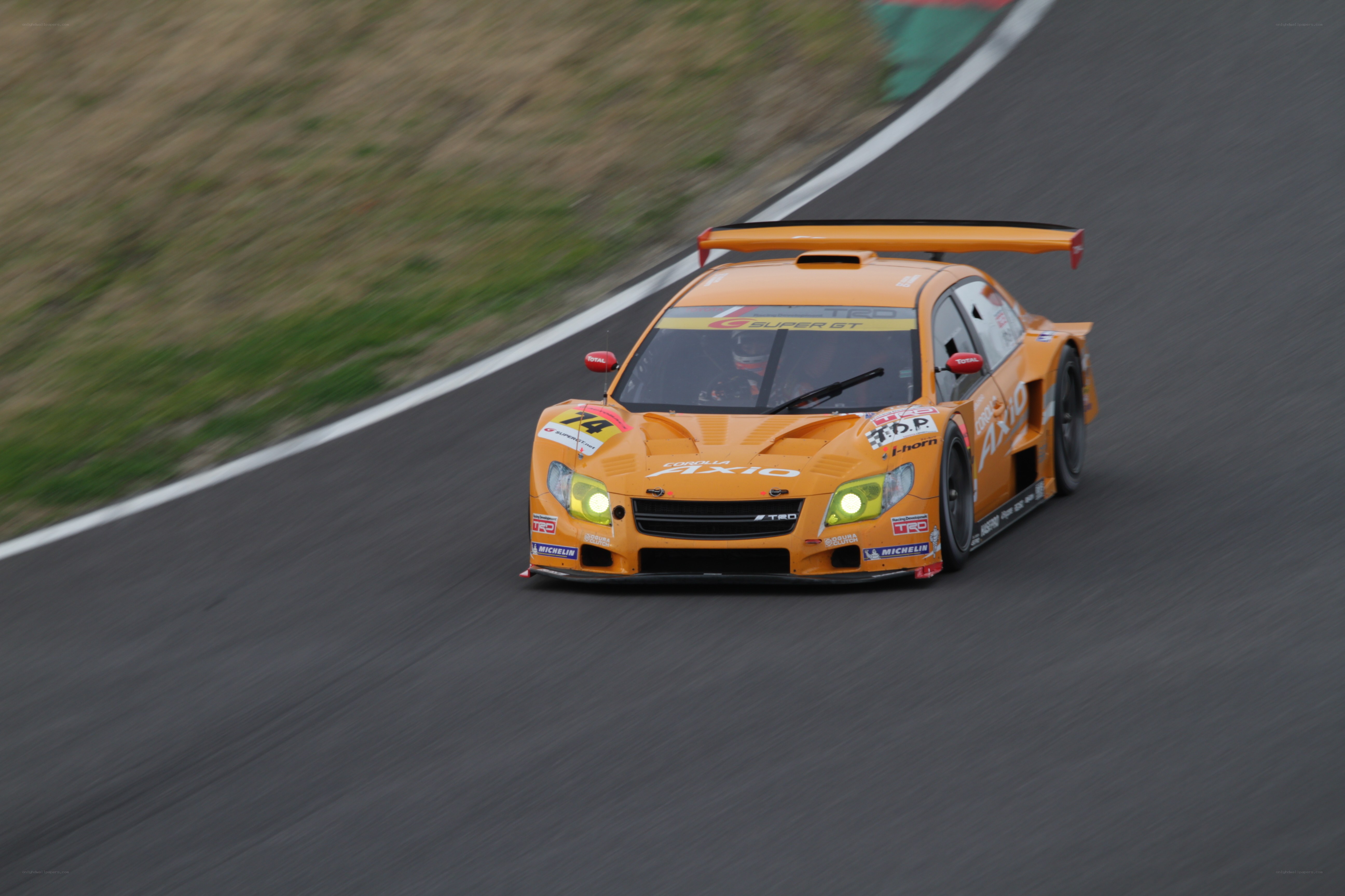 Orange race car on track