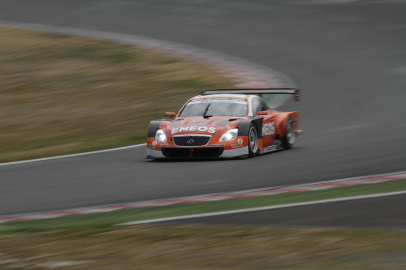Orange race car on track