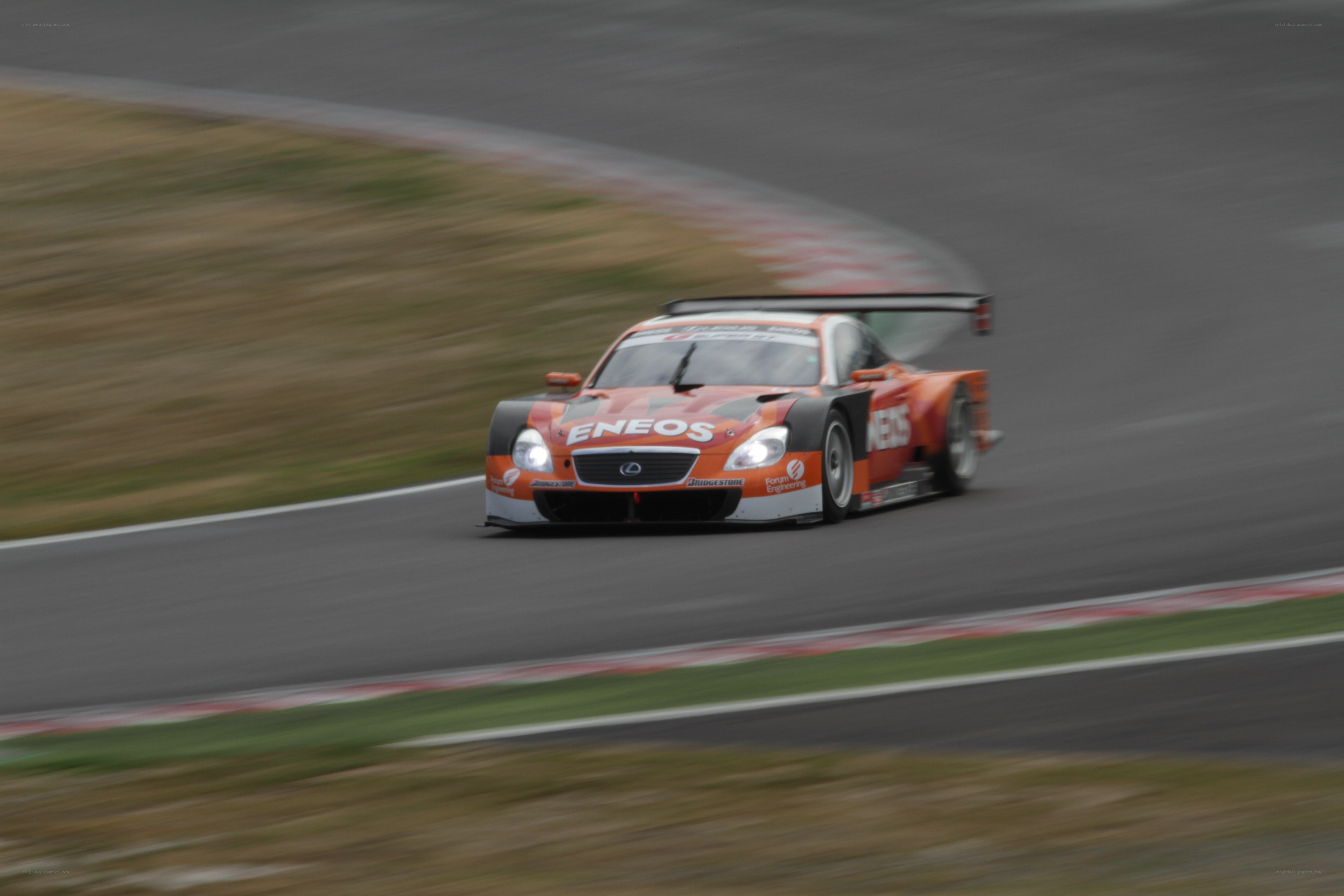Orange race car on track