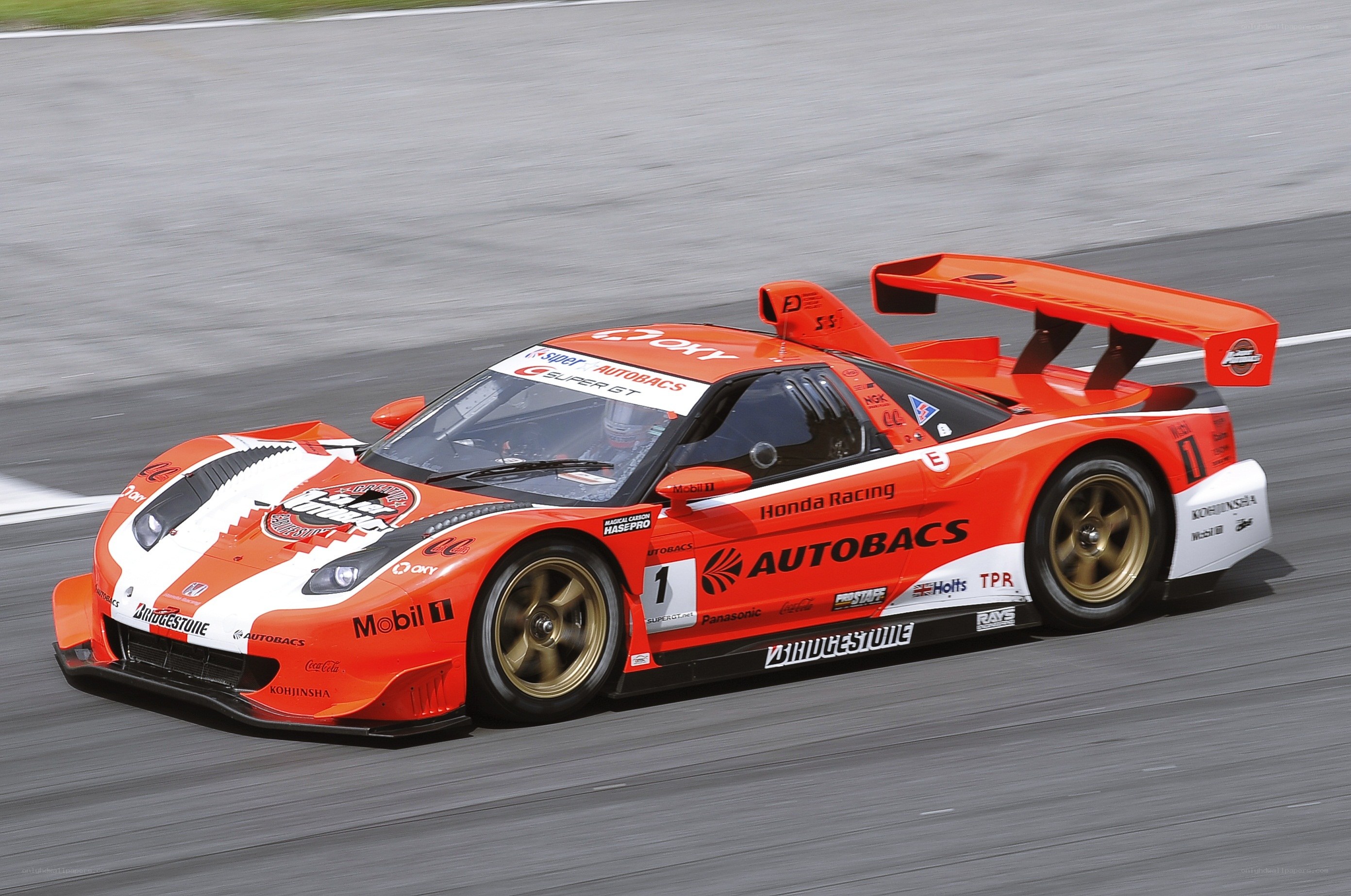 orange race car on track