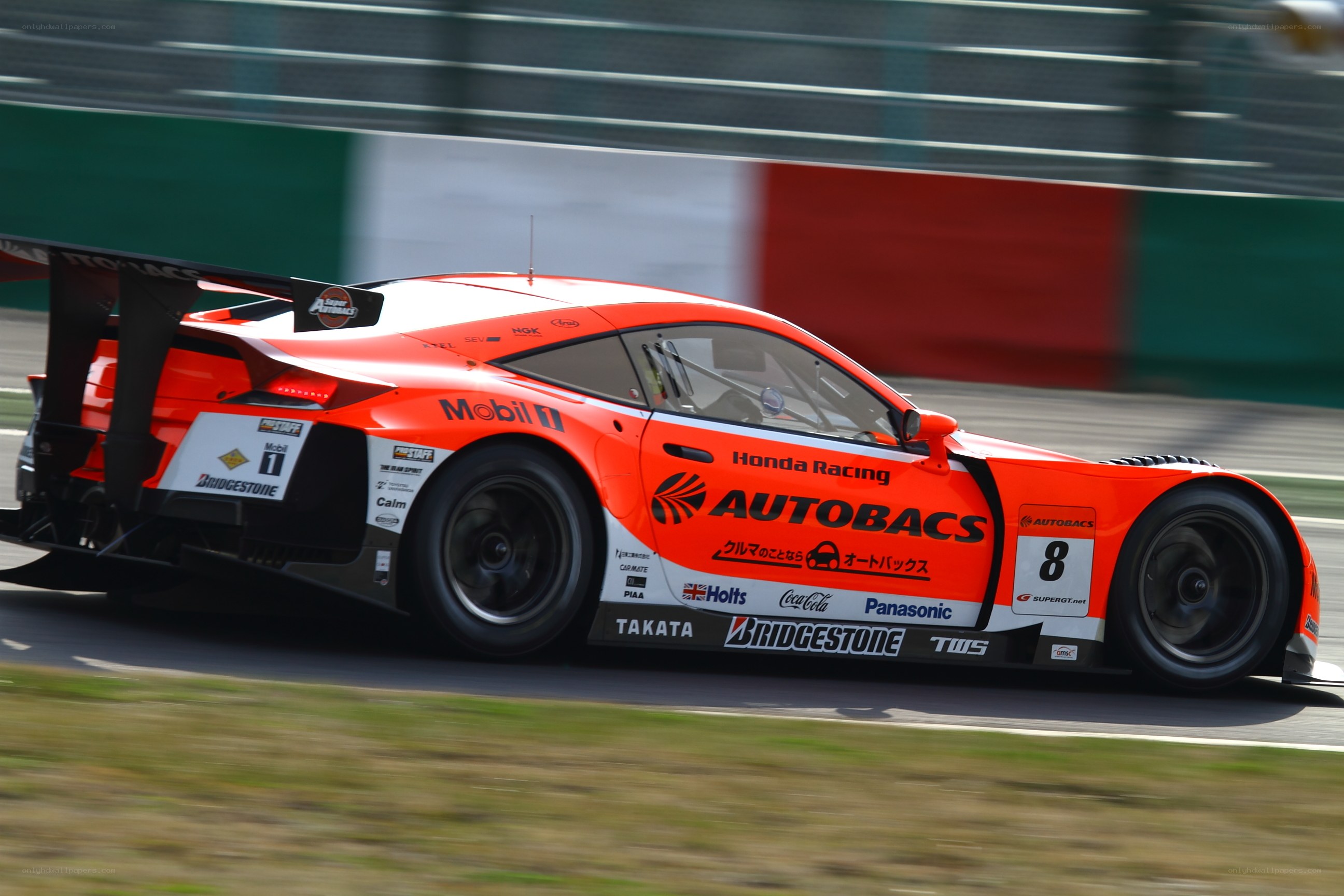 orange race car on track