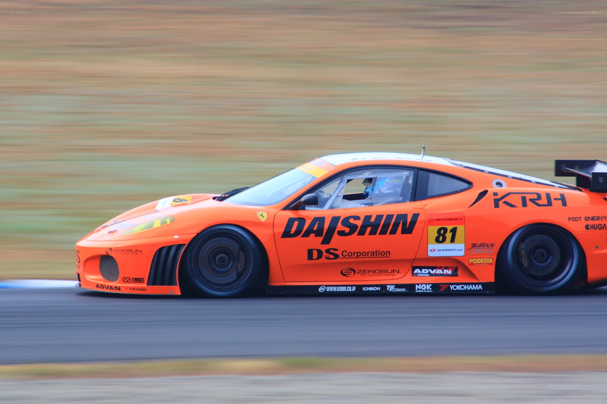 orange race car on track