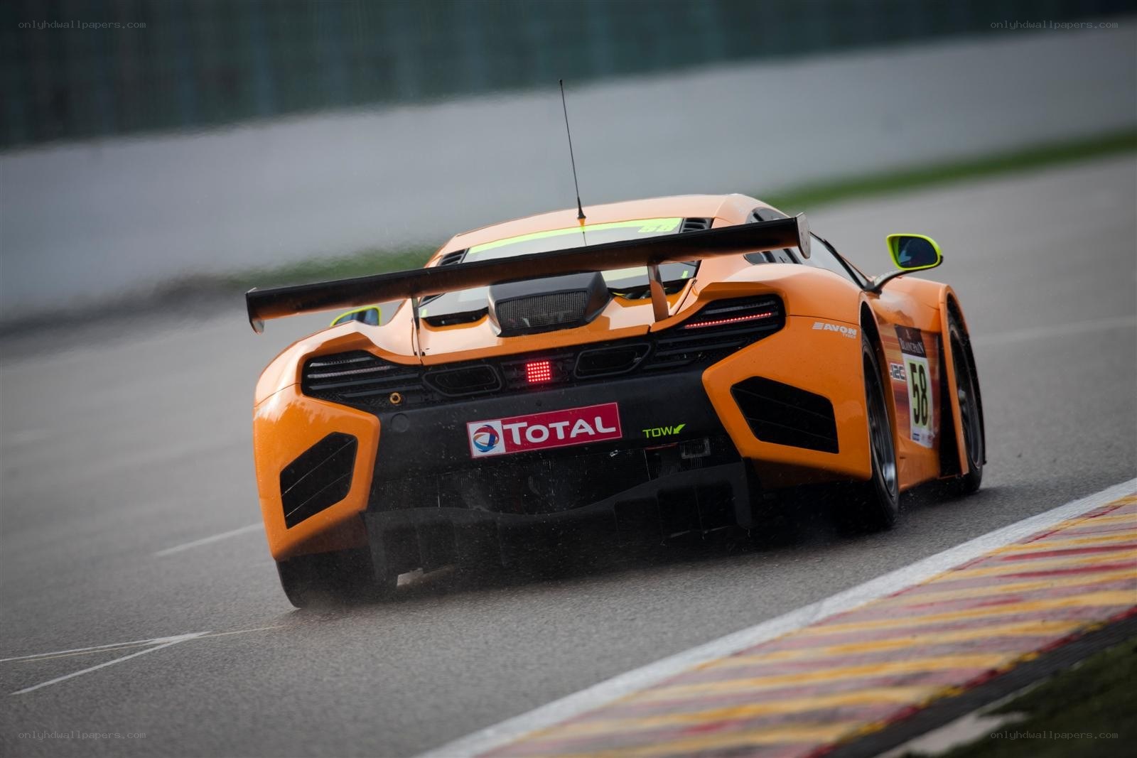 orange race car on track