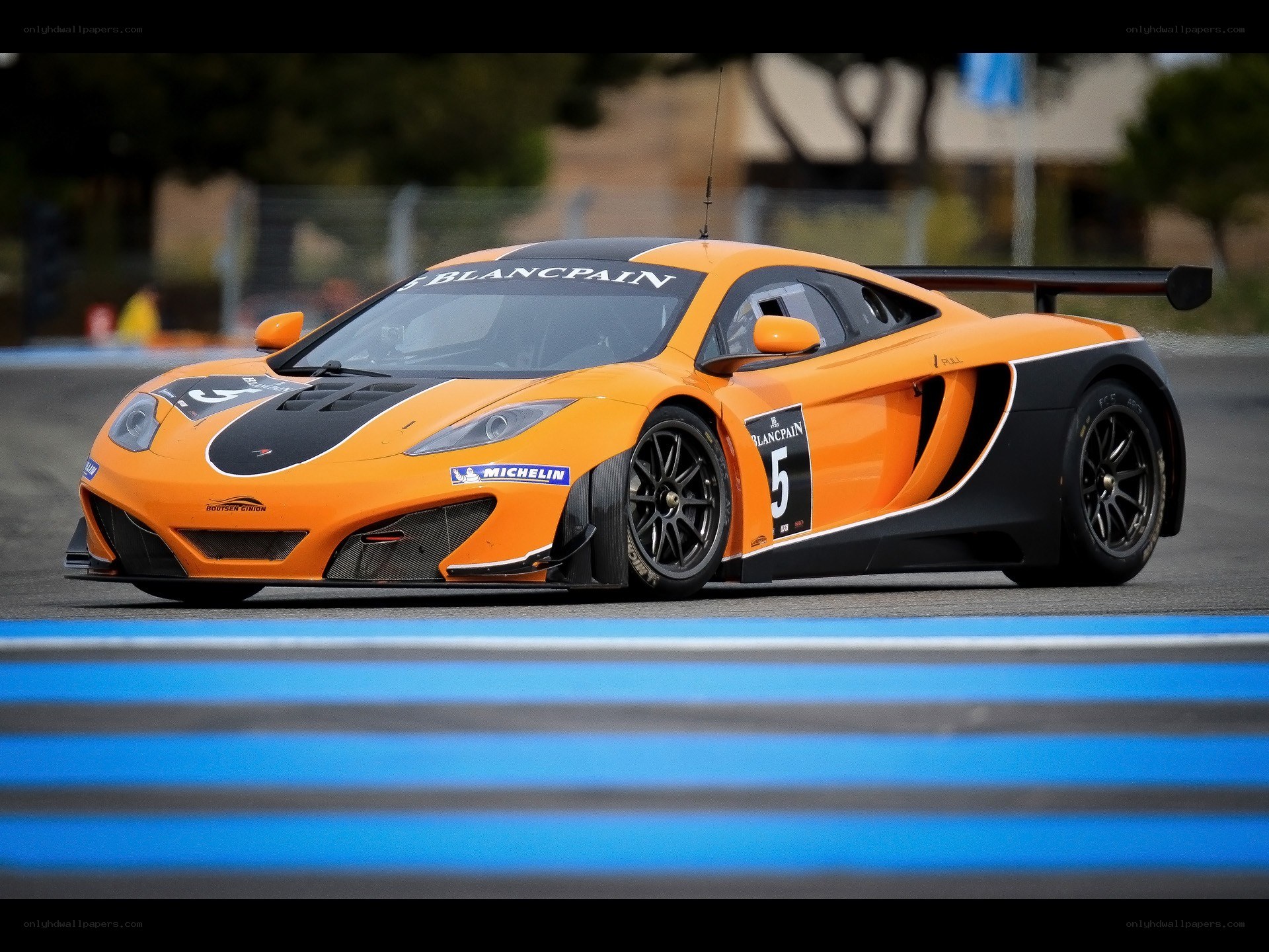 Orange race car on track