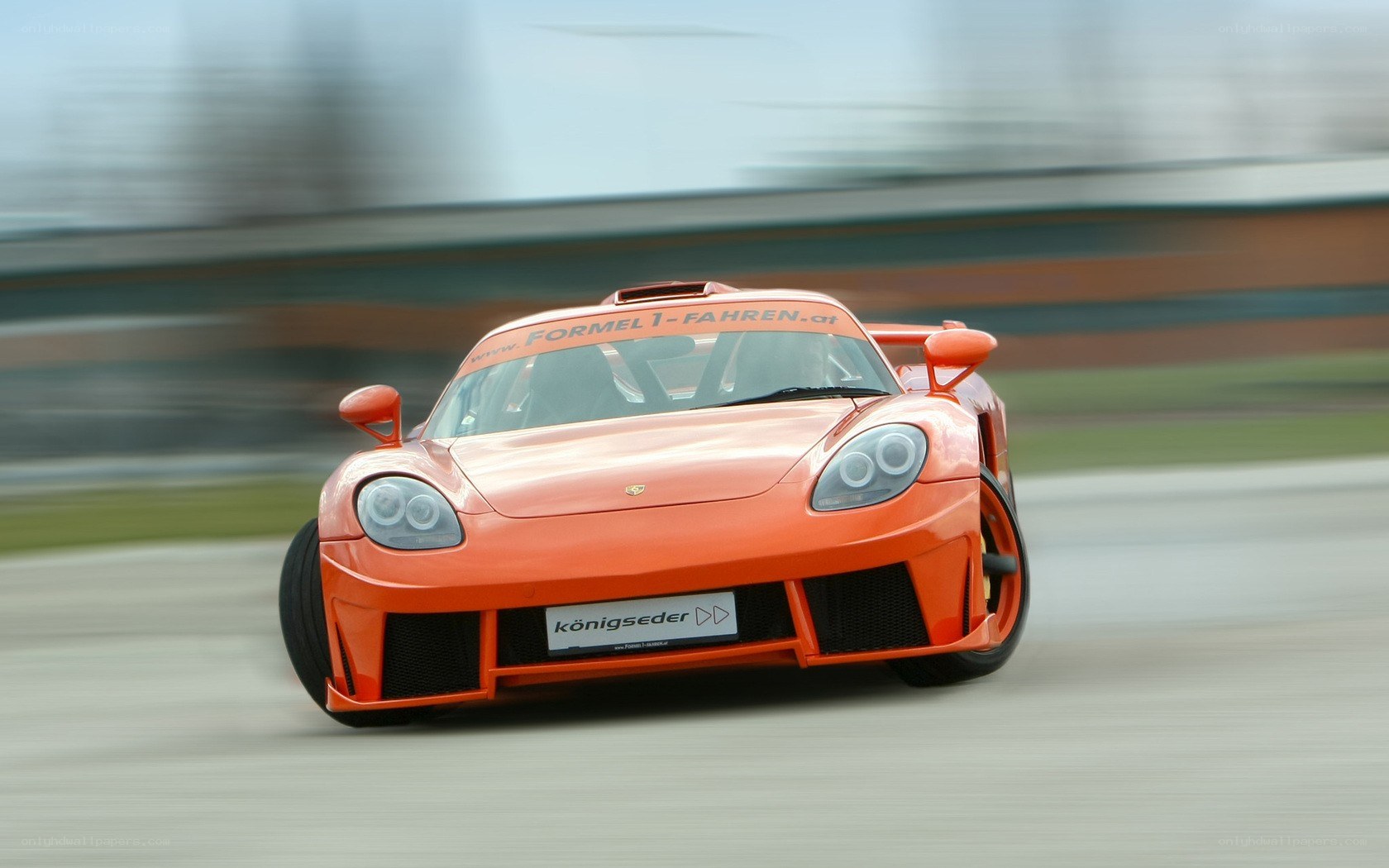 orange race car on track