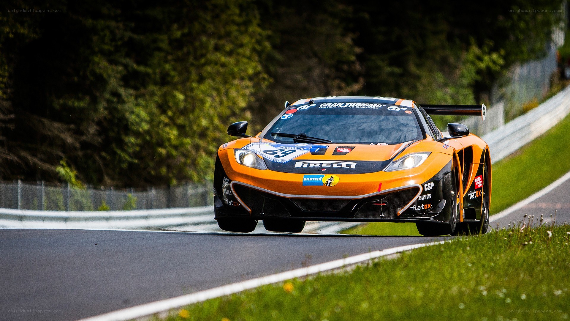 orange race car on track