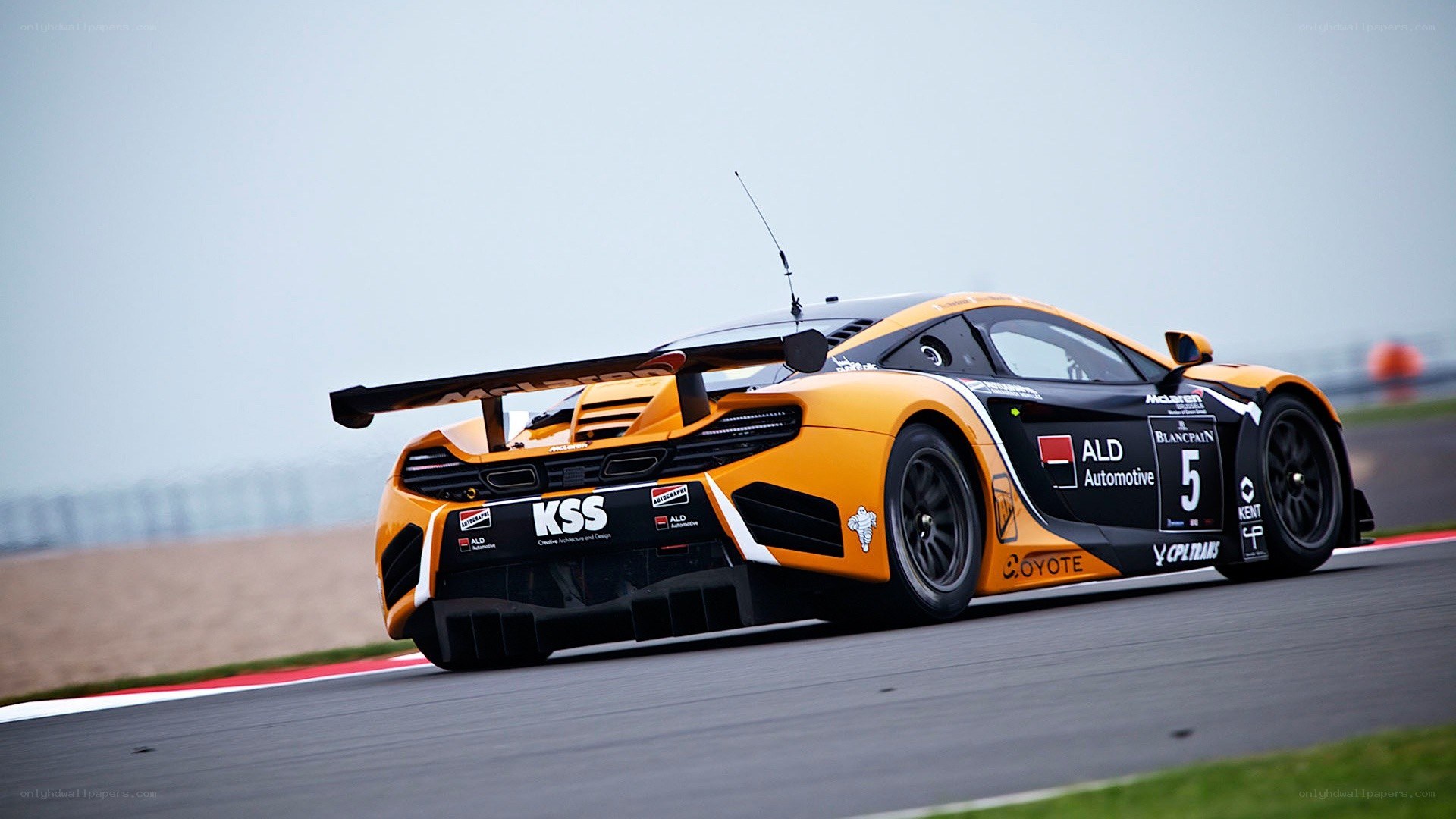 orange race car on track