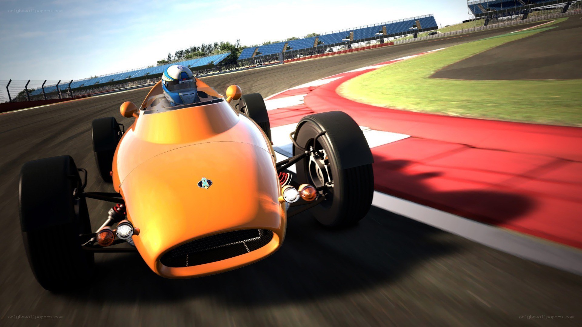 orange race car on track