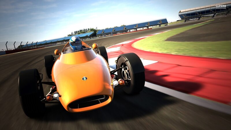 orange race car on track
