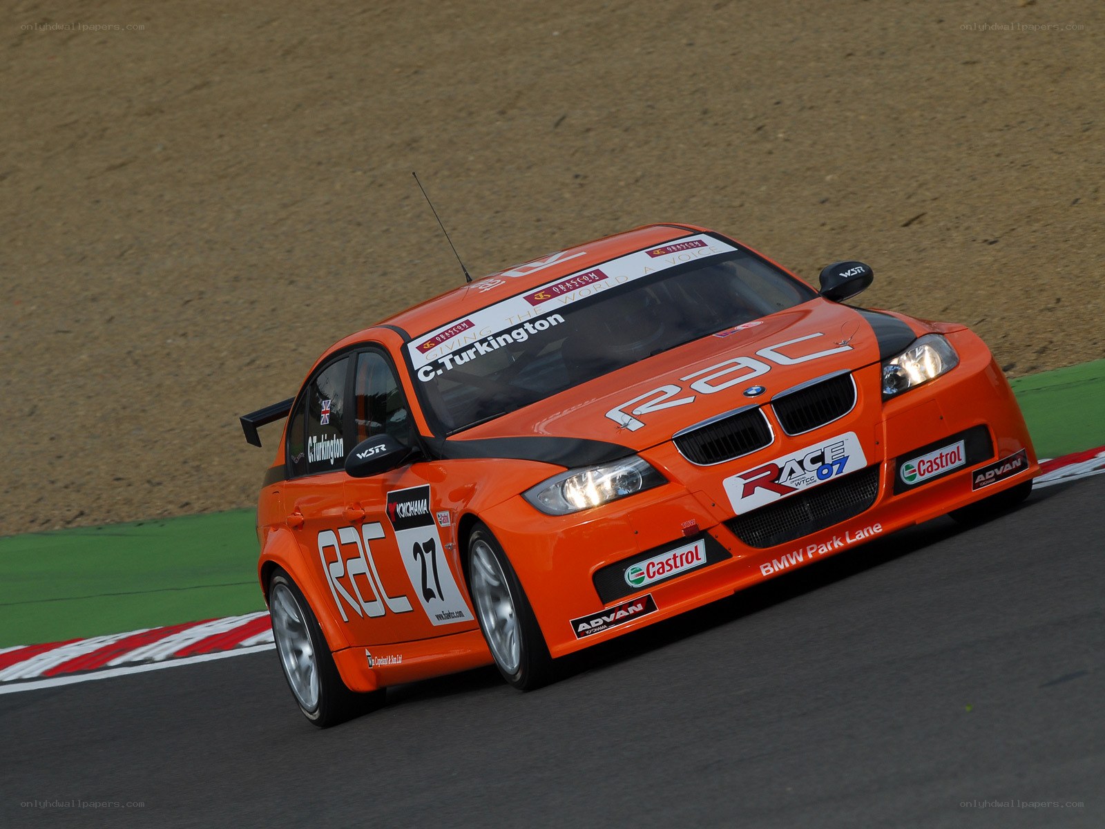orange race car on track