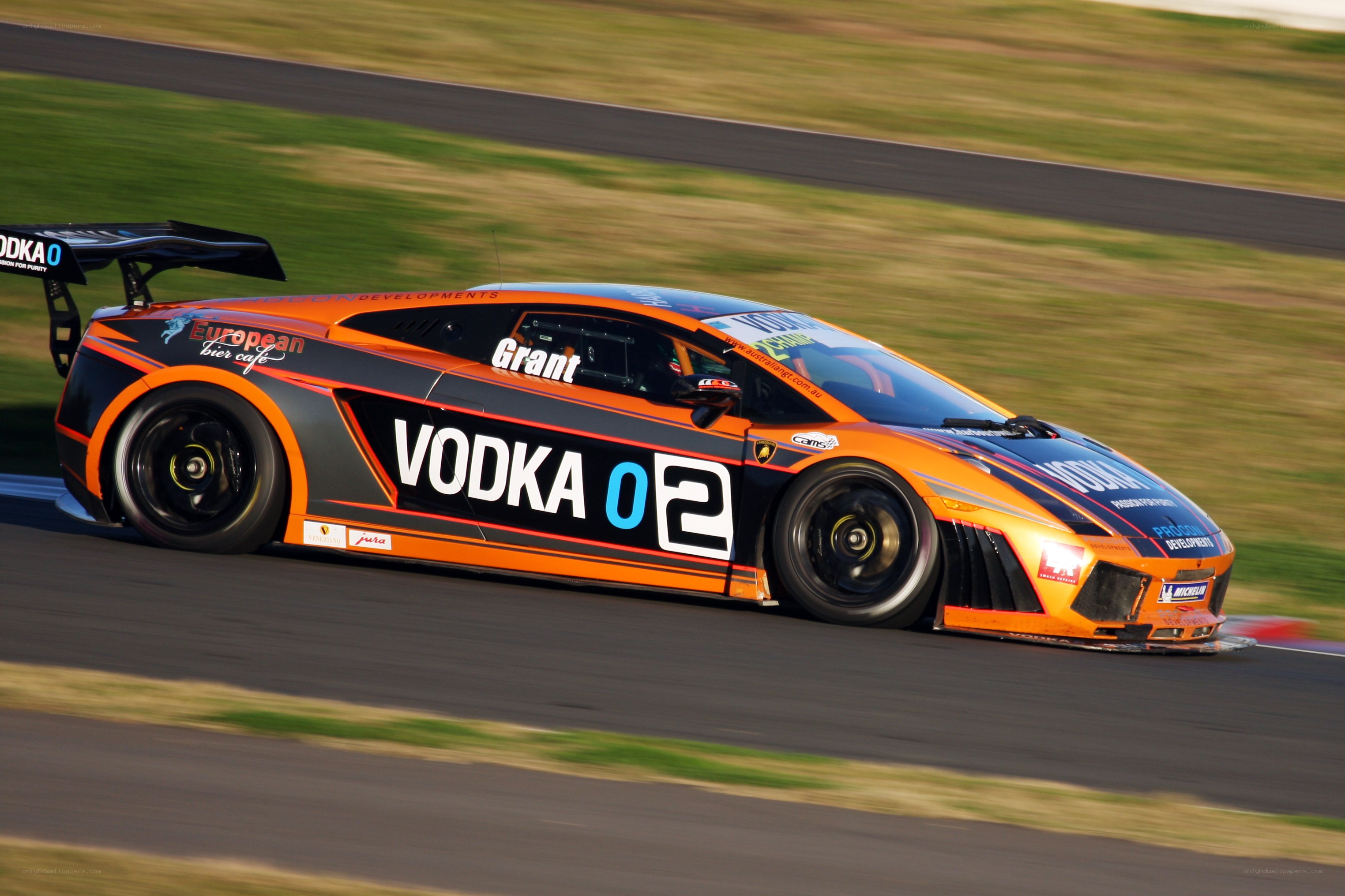 orange race car on track