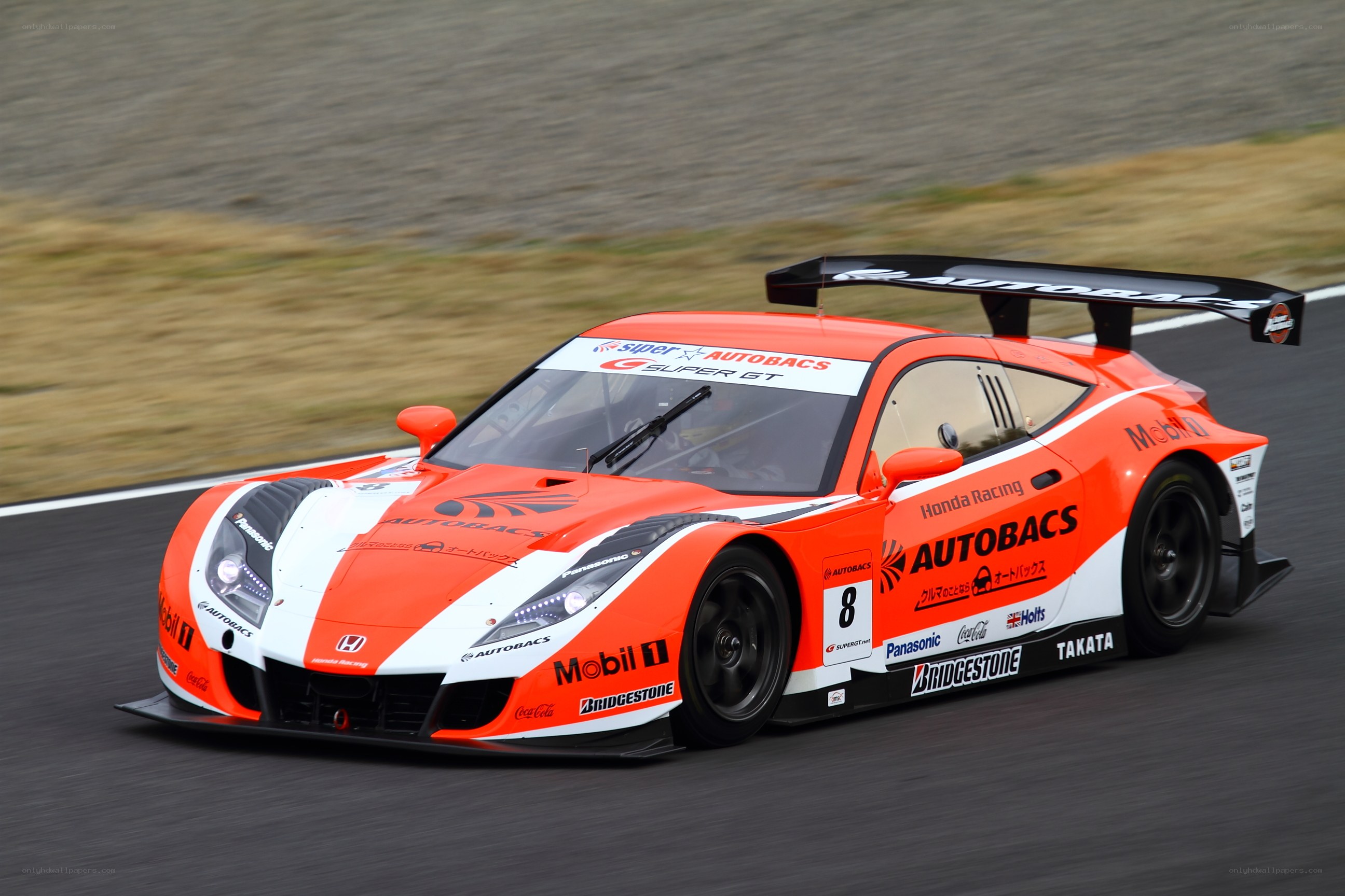 orange race car on track