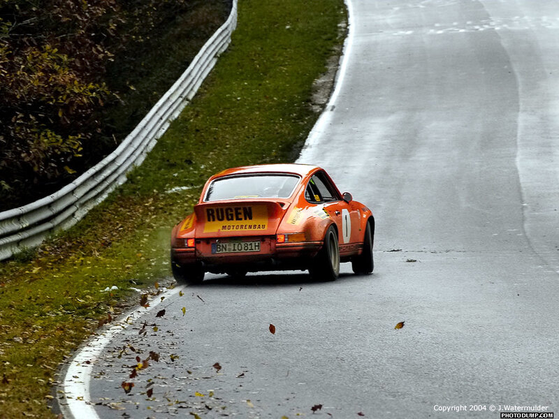 orange race car on track