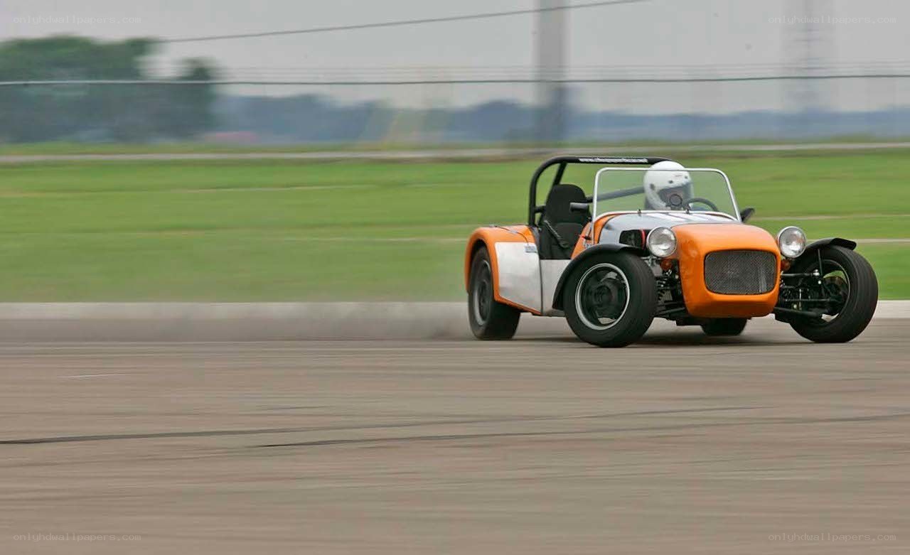 orange race car on track