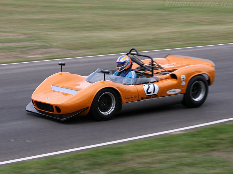 Orange Race Car on Track — Dynamic, Afternoon, Photograph