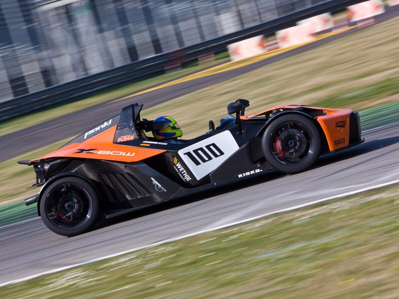 Orange Race Car on Track — Dynamic, Afternoon