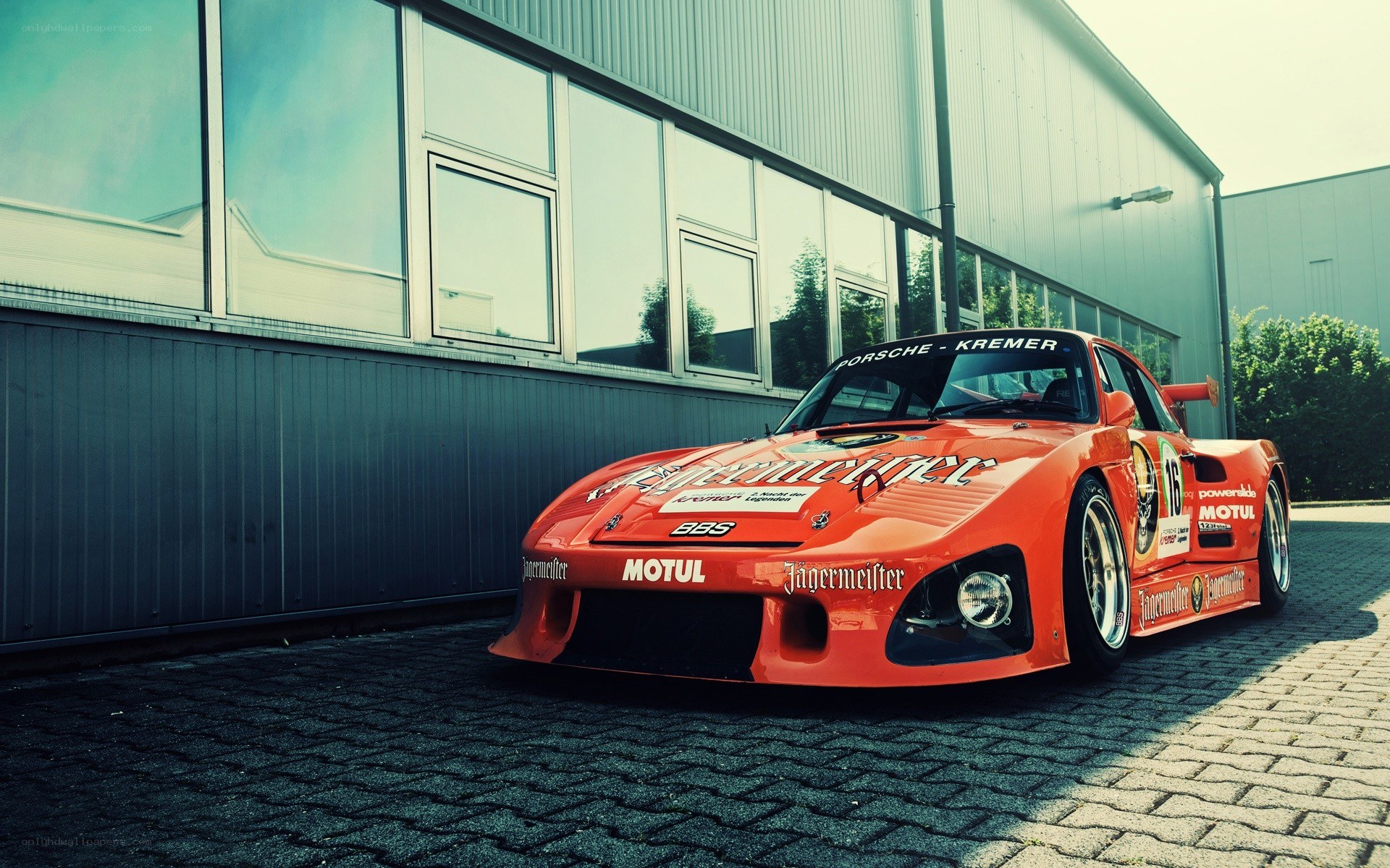 orange race car parked outside