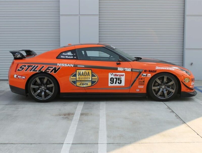 orange race car with sponsor decals