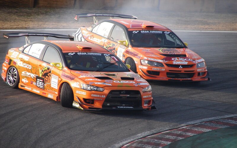Orange Race Cars Drifting — Dynamic