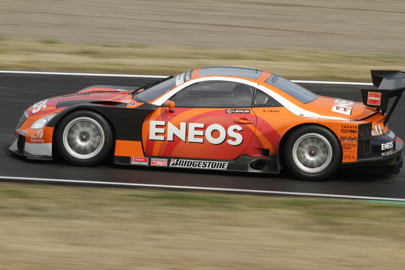 Orange racing car on track