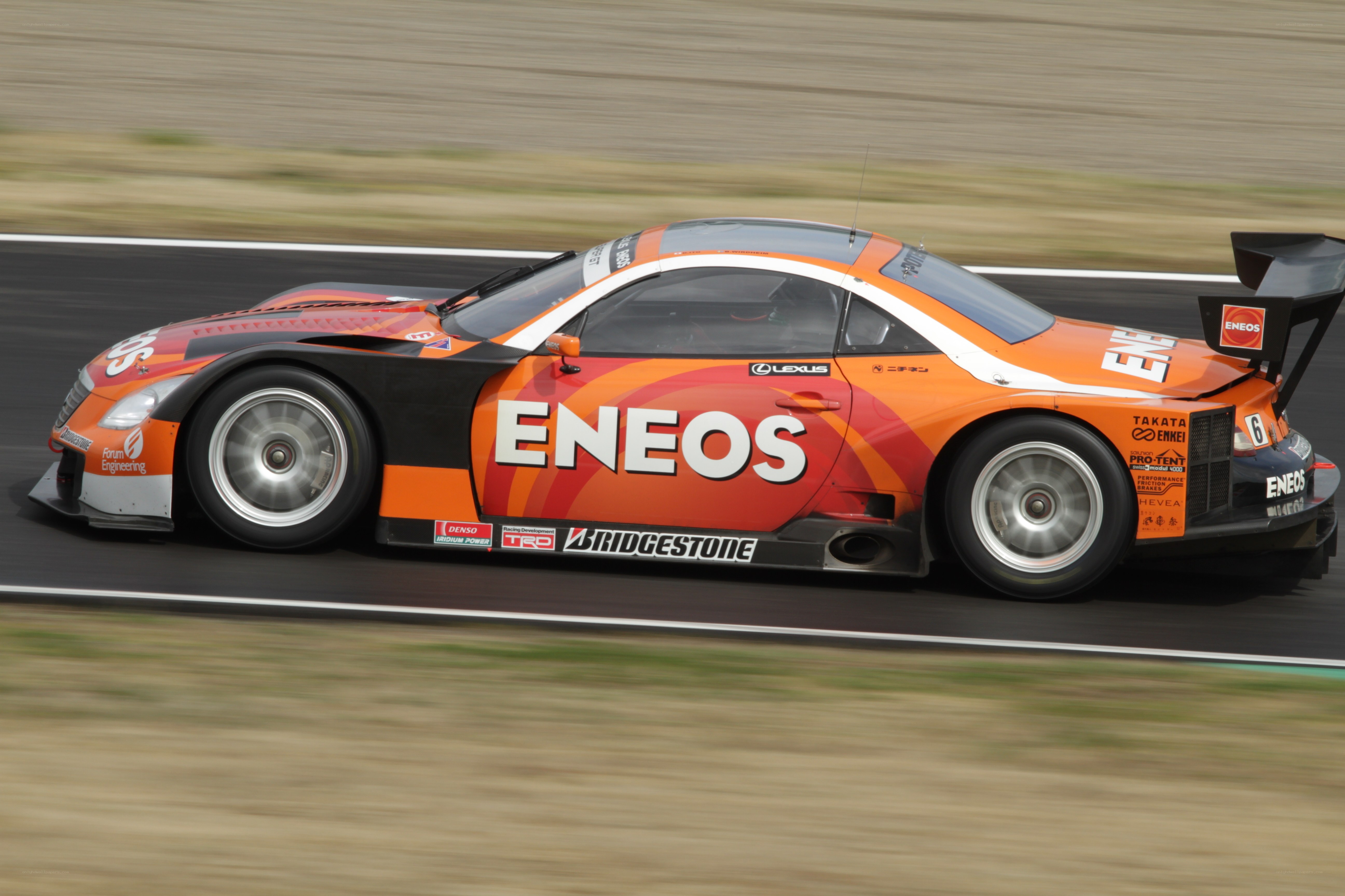 Orange racing car on track